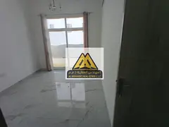 One-bedroom apartment for rent in Al Jurf 3 with a balcony, two bathrooms, and central air condition