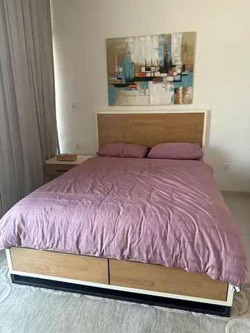 Queen size bed with side table