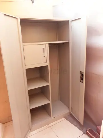 Used Metal Wardrobe / Armoire with Shelves and Lockable Compartment