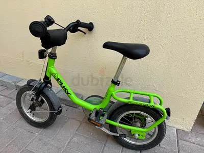 Green Puky Kids Bike with Pedals and free helmet