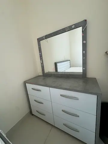 Bed with two side tables with mirror