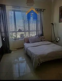 Two-bedroom apartment with a living room, lowest price in Sharjah