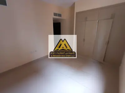 Two-bedroom apartment with living room in Al Hamidiya 1, Ajman, balcony, built-in wardrobes, central AC, AED 41,000 in 4 installments, spacious layout