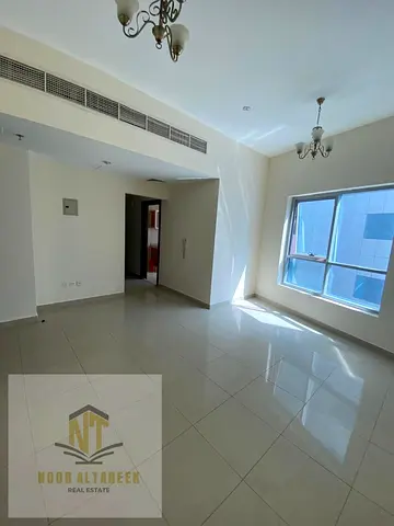 A great opportunity to rent in Al Khan – Sharjah: a bedroom and living room with a swimming pool and free parking