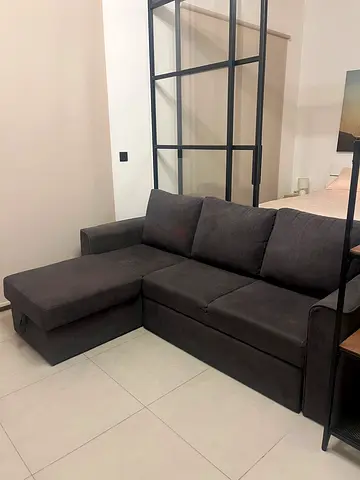 Dark grey L-shaped fabric sofa - good condition