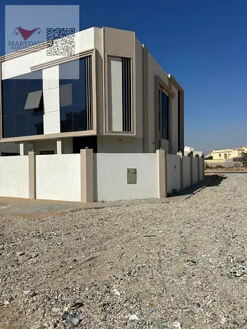 Corner villa for rent at an attractive price in Al Yasmin area. First occupancy. Modern design, high-end finishing, prime location close to all services and behind Al Hamidiya Park.