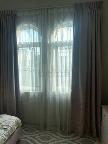 Full-length beige blackout curtains with sheer voile panels - set for double window