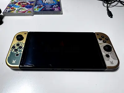 Nintendo Switch Console with Custom Gold Joy‑Con Covers (Good Condition)