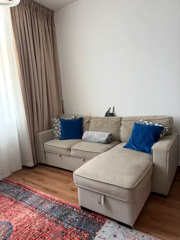 Light beige L-shaped sofa with chaise - good condition