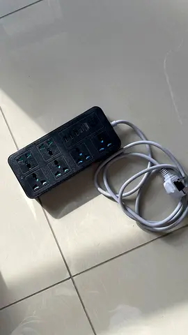 Used Power Strip with Multiple Universal Sockets and Surge Protection