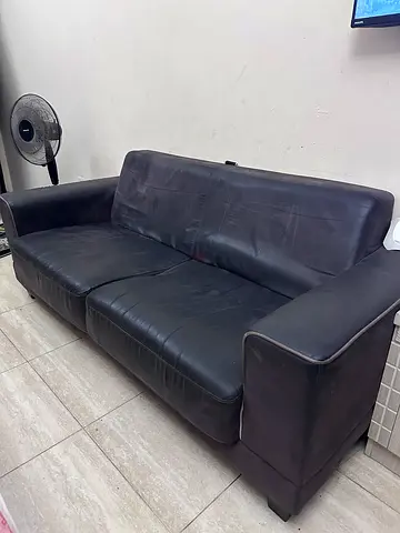 Dark brown two-seater leather sofa (used) - compact corner style