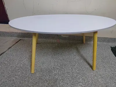 Simple Oval Coffee Table with White Top and Yellow Legs