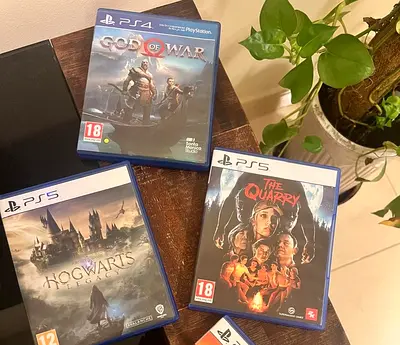 Collection of  PS5 games: $% of War, Hogwarts Legacy, The Quarry,