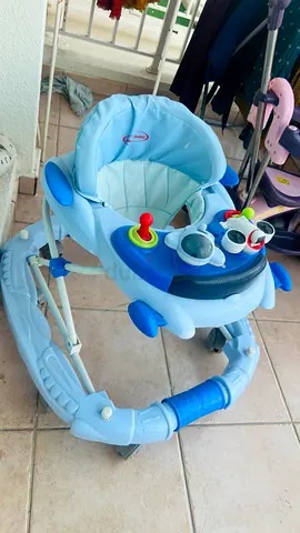 Light blue baby walker with activity tray — good condition