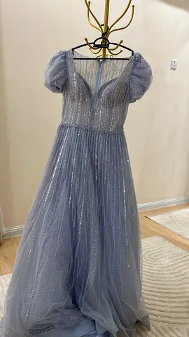 Light blue shimmery tulle evening gown with puff sleeves