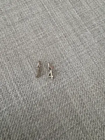 Pair of small silver initial/number pendants (A and 1) — lightweight charms