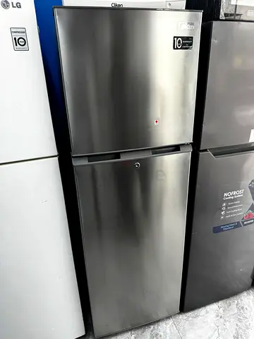 Used double-door refrigerator - good condition, stainless steel finish