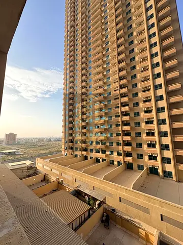 1BR apartment with hall in Emirates City, 1300 sq ft, 2 bathrooms, well‑finished, priced at AED 320,000 — a great residential and investment opportuni