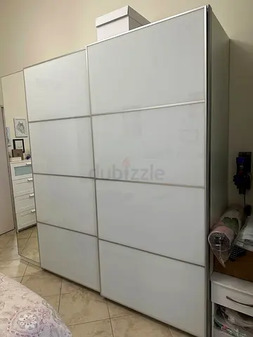 Selling my excellent IKEA Sliding Door Wardrobe - White Glass Panels, 2 Doors. Original price 5600