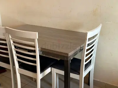 Wooden Dining Table with 3 White Ladder-Back Chairs - Good Condition