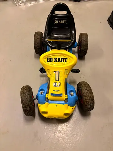 Used kids pedal go-kart with large rubber tires – good condition