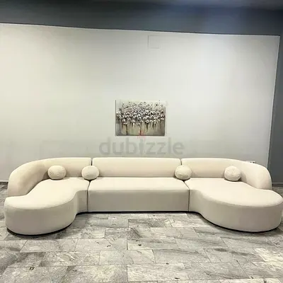 Modern Curved Cream Sofa with Round Cushions