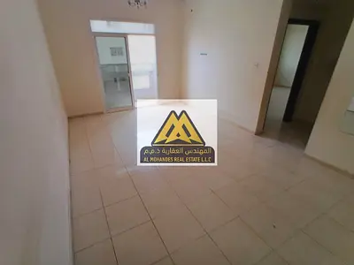 Two-bedroom apartment with a living room for rent in Al Nuaimiya 2 on King Faisal Street, with central air conditioning and free maintenance at a spec