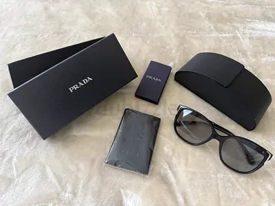 Prada black cat-eye sunglasses with original case and box