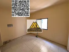 A spacious studio for annual rent in Al Nuaimiya 2 – Ajman, featuring a semi-separated kitchen and
