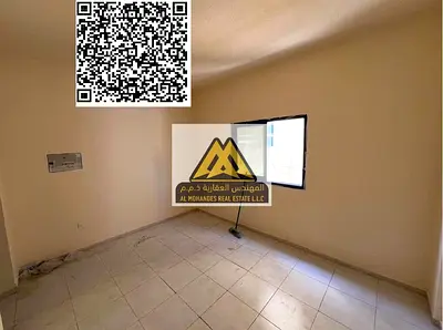 A spacious studio for annual rent in Al Nuaimiya 2 – Ajman, featuring a semi-separated kitchen and central AC, located in a lively area close to all s