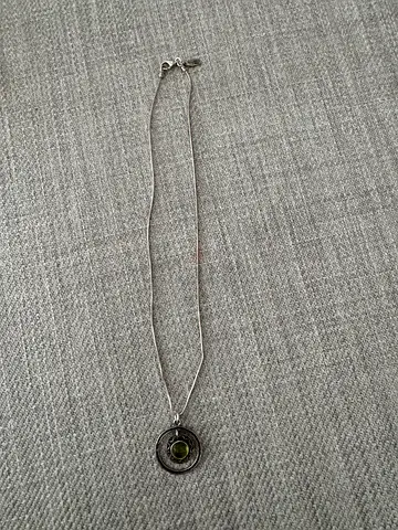 Silver pendant necklace with peridot gemstone