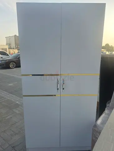 White 2-Door Wardrobe with Gold Accent - Good Condition
