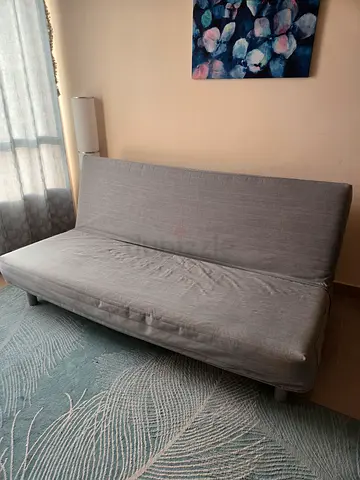 Light grey convertible sofa bed - compact and clean