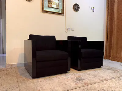 Pair of Modern Black Armchairs with Glossy Side Panels