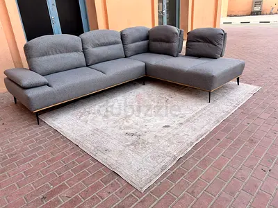 Home Center Limo Corner SModern L-shaped Grey Fabric Sofa with Adjustable Headrests - Good Condition