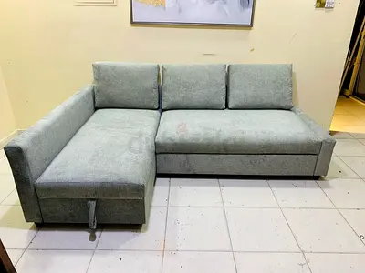 Light grey L-shaped sofa with storage - good condition