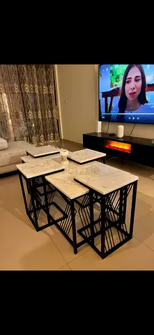 Set of 4 Marble-Top Nesting Side Tables with Black Metal Frames(one of the side tables is chipped)