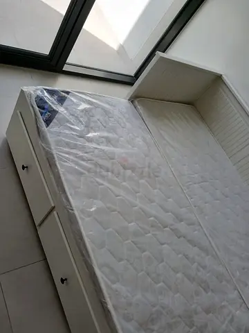 Ikea White wooden daybed with storage drawers and mattress