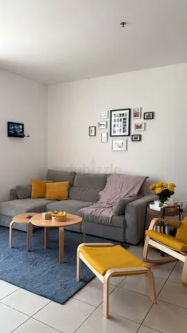 Gray Fabric Sofa Set with Blue Rug and Wooden Coffee Tables