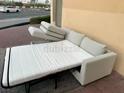 Ikea beige color lshape sofabed with storage space