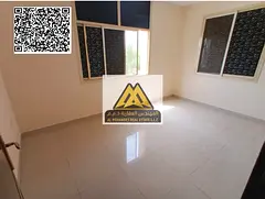 A 1-bedroom apartment with a living room for annual rent in Al Nuaimiya 2 – Ajman, featuring a spa