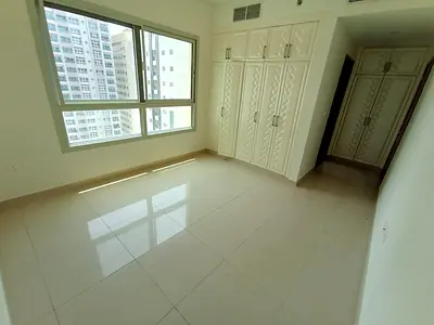 One bedroom and living room for rent in Al Taawun, central air conditioning, balcony, built-in wardrobes, gym, and parking. Prime location near Nesto,