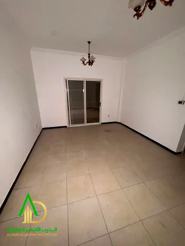 1-bedroom apartment with a living room for rent in Al Nuaimiya 2, Ajman. Prime location near all services, suitable for families. Annual rent AED 26,0