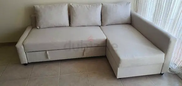 Light beige L-shaped sofa with storage —good condition