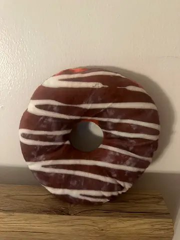 Decorative donut-shaped cushion / pillow (brown with white stripes)