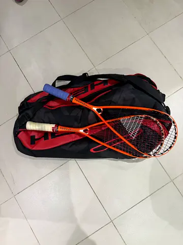 Two used squash rackets with carry bag - good condition