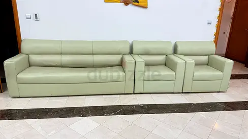 Light green leather 3-seater sofa with two matching armchairs - good condition
