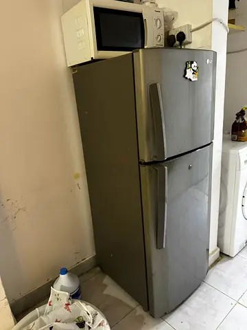 Silver double-door refrigerator (top freezer) - used, good condition