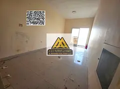 A spacious studio for annual rent in Al Hamidiya – Ajman, featuring a balcony with an open view, l