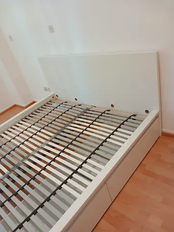 Ikea White platform storage bed frame with headboard